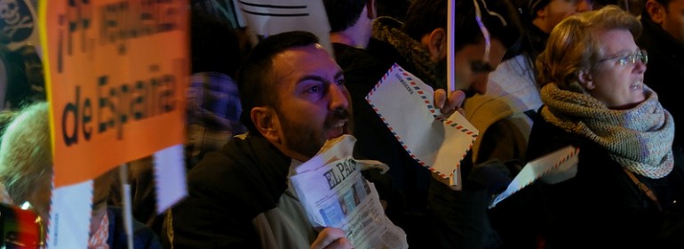People protest in Genoa Street, Madrid, close to the PP headquarters
