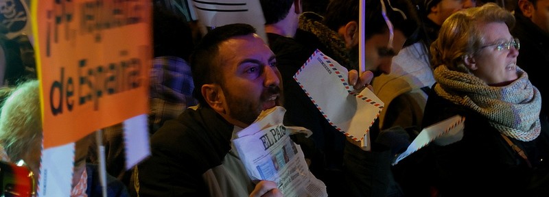 People protest in Genoa Street, Madrid, close to the PP headquarters