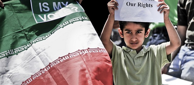 A child of Iranian descent shows his dissatisfaction with the results of the recent elections in Iran. Iranian students, faculty, community members and supporters gathered in front of Burruss Hall on the Virginia Tech campus on June 24, 2009, to protest the results of the Iranian presidential elections